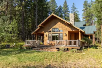 Private setting surrounded by evergreens with a welcoming deck to enjoy the peaceful forest setting.
