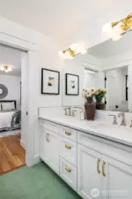 Main level full bath has 2 sinks and both baths have designer tile.
