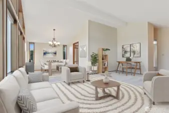 Formal living room with vaulted ceilings, opens to the formal dining room.  Wall of windows provides year round natural light- Virtually staged photo.