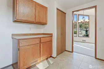 Kitchen features oak cabinets, stainless appliances including a newer kitchen aide downdraft range, an eating bar and opens to family room.