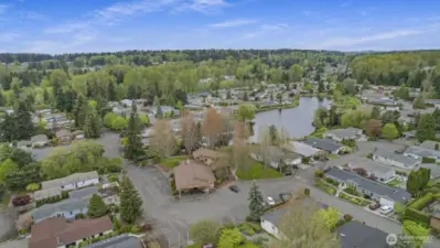 Wandering Creek Common Area: Drone view of the Clubhouse and Reflection lake, just a couple houses away from the home.