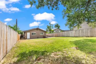 additional view of large fenced backyard