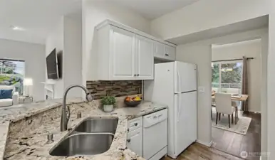 Deep double stainless sinks with direct access to formal dinning room