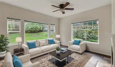 Family room with fire place and large windows