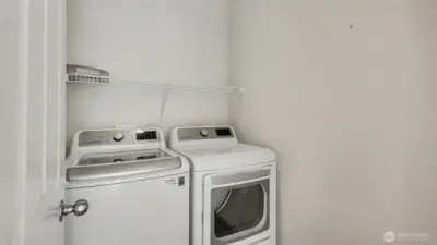 Laundr on upper level between the two bedrooms.