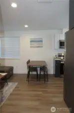 ENTERING THE COTTAGE TO THE FIRST LEVEL WITH EASY CARE VINYL PLANK FLOORING THROUGH OUT!