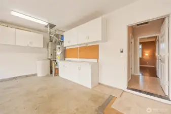 More than just parking space, the oversized two-car garage is thoughtfully equipped with built-in cabinetry, extended workspace, and organized storage solutions. Ample overhead cabinets and a dedicated workbench area provide exceptional functionality for projects, hobbies, or seasonal storage, while direct interior access ensures seamless everyday living. The furnace has been recently serviced, reflecting pride of ownership and ongoing care.