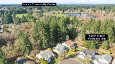 A true highlight of this home is its private backyard gate offering direct access to the lush HOA greenbelt, seamlessly connecting you to Woodland Creek Community Park and the scenic trail system beyond. Enjoy morning walks, playground outings, and peaceful wooded paths just steps from your yard, with the Lacey Community Center conveniently located within the park for year-round events, recreation, and community gatherings. This rare connection to nature and neighborhood amenities creates an exceptional lifestyle of convenience, privacy, and outdoor enjoyment right at your doorstep.