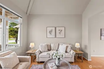 The Perfect Retreat. Relax in a light-filled living space designed for comfort. The large picture window frames the lush greenery outside, while the clean lines and spacious layout offer endless possibilities for personalized styling and cozy gatherings.