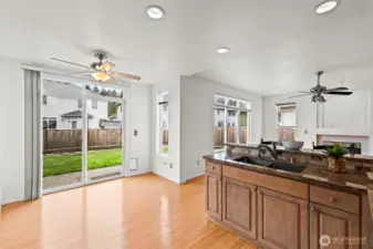 Indoor-Outdoor Living. Enjoy a bright breakfast nook situated right next to the sliding glass doors. Step outside to the patio for alfresco dining or to enjoy the fully fenced backyard—the perfect setup for summer BBQs and outdoor play.