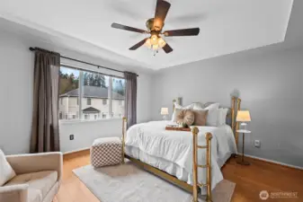 Your Private Oasis. Retreat to the spacious primary bedroom, featuring a tray ceiling and a large window that invites in plenty of natural light. With room for a king-sized bed and a cozy seating area, it is the ultimate sanctuary for rest and relaxation.