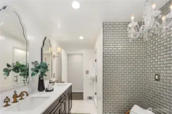 Luxurious guest bath on the main level offers a serene retreat that may make your guests never want to leave.