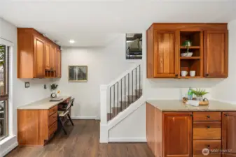 Coffee station with dedicated space for all your favorite mugs makes mornings effortless, while the nearby built-in family command center, with desk, shelving, and organized storage for mail and daily essentials, keeps everyone on track and ready to start the day.