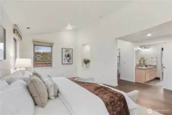 Sumptuous primary suite featuring a spacious walk-in closet and luxurious five-piece bath with soaking tub.