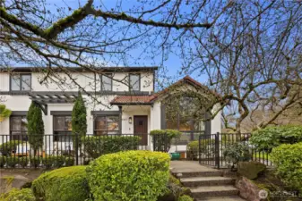 Mature magnolia trees create a stunning seasonal display and add timeless beauty to the home’s outdoor spaces.