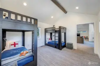a large "Party Suite" with bunkroom, accommodating four bunks equipped with USB charging and serviced by a full bath.
