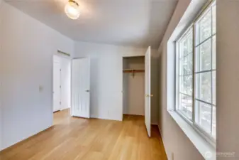 Bedroom #3 with view of the additional closet across the hall.