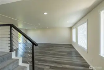 Stairs to upper level with 4 bedrooms and two full bathrooms.