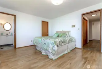 primary bedroom with a .75 bath and walk-in closet