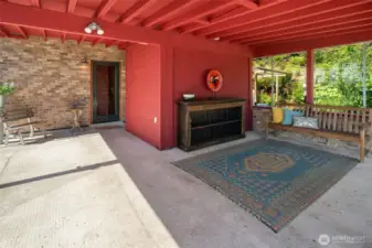 Carport, currently used as an entertaining area, storage, and Sauna.