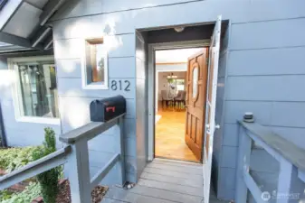 Covered front porch welcomes you; original hardwoods and vintage charm invite you to step inside.
