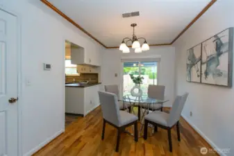 Pretty dining room is adjacent to kitchen and offers covered patio access.