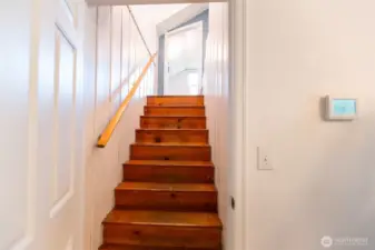 Up the stairs from dining room to another potential bedroom.
