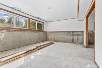 Downstairs living - recent water damage. Professionally dried and transferable lifetime warranty waterproofing to be completed in November!