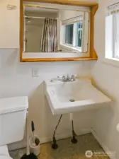 Bathroom has a walk-in shower and vintage charm