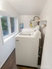 Utility room with washer and dryer.