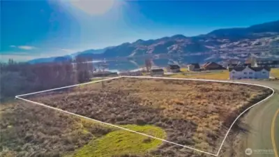 Level buildable corner lot 2.47 acres with beautiful views of Lake Osoyoos, mountain ranges and City of Osoyoos British Columbia.  Access of paved, county maintained Eastlake Rd.