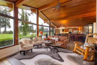 Heightened windows add to the gorgeous views of the 17th tee in the living room.
