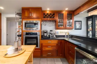 The lovely bar area is perfect for entertaining!  Kitchen island stays.