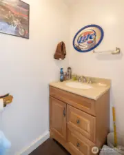 No need to go inside the house - here's a half bath located in the shop.