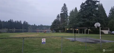 Community playground, beach, swimming area.