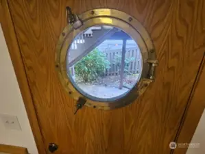 A real porthole window in the utility room.