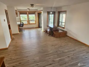 Open space over to the dining and kitchen area and the sliding door to the sun room.