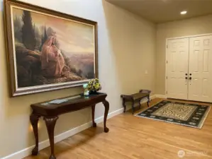 Photo taken by Seller prior to Tenant Occupancy. Entry with 2-story vaulted ceilings