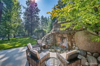 Stone and Basalt Fire place with wood shed behind