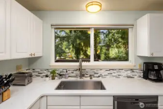 New countertops, sink, and appliances.