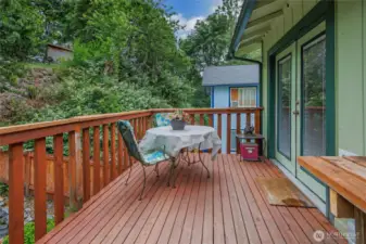 Upper deck opens through French doors off the dining area, creating a seamless indoor-outdoor flow perfect for entertaining or relaxing.