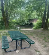 Located just moments from the home, enjoy a peaceful riverside setting with a favorite local swimming hole and picnic tables—ideal for sunny days, outdoor meals, and a quick escape into nature.