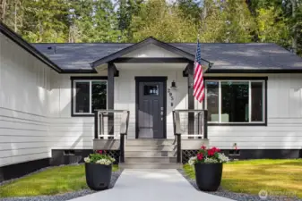 A welcoming front entry with modern black-and-white finishes sets the tone for this 2023-built Westcott Bay home.
