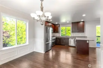 Dining area looking to kitchen