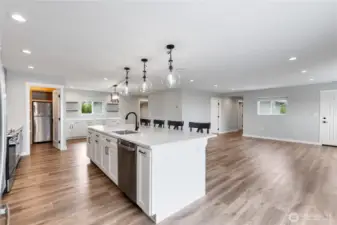 Great room with eating island, living and dining room
