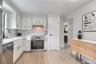 Kitchen features brand-new stainless appliances and hardware.