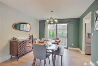 Dining room has a sliding door that opens up to the back yard.