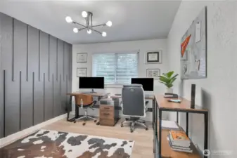 2nd bedroom or office with trendy wall, new flooring, and lighting.