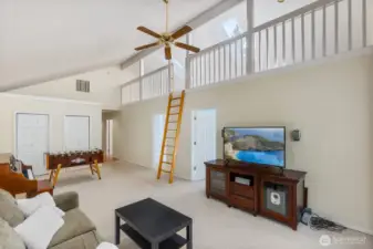 Another view of the family room shows the neat loft and extra closets for great storage.