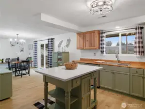 View from kitchen to 2nd dining area and sliding door to the backyard deck.